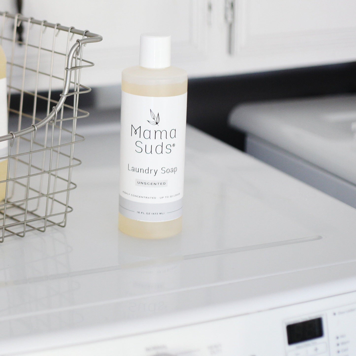 Unscented MamaSuds laundry detergent soap in a 64-ounce bottle, household cleaning product for effective fabric cleaning.
