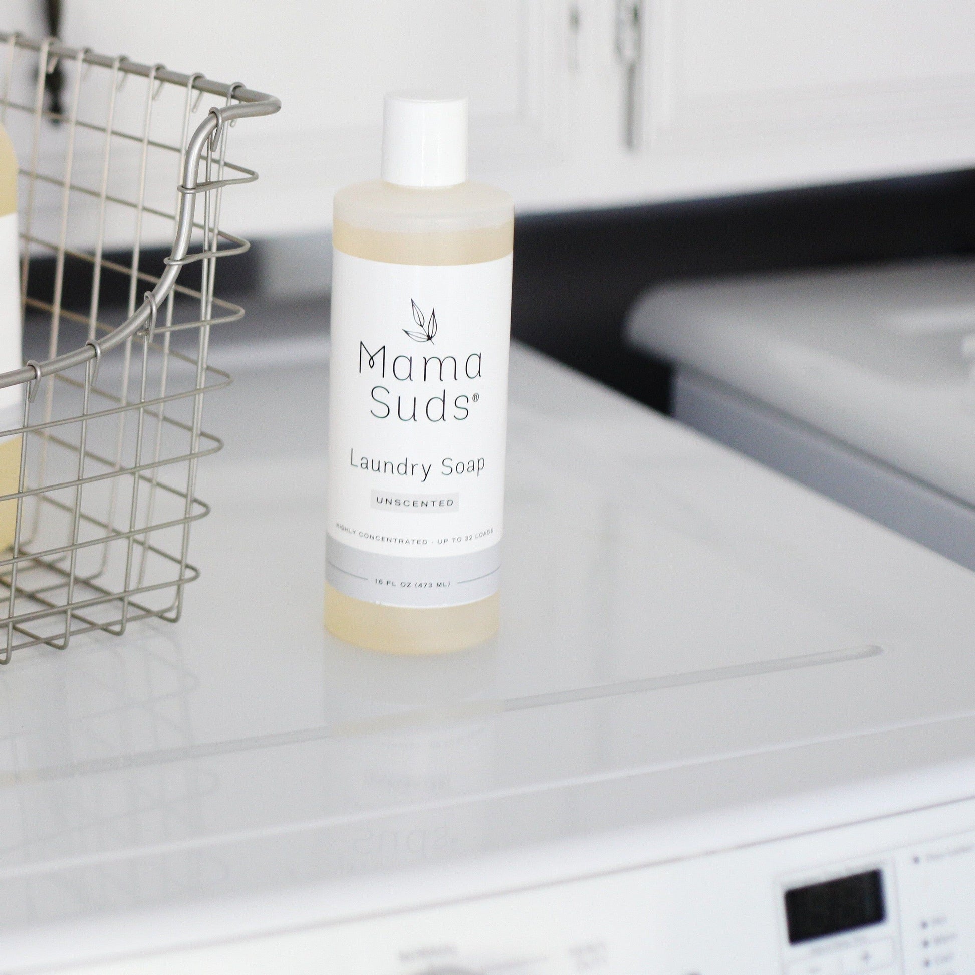 Unscented MamaSuds laundry detergent soap in a 64-ounce bottle, household cleaning product for effective fabric cleaning.