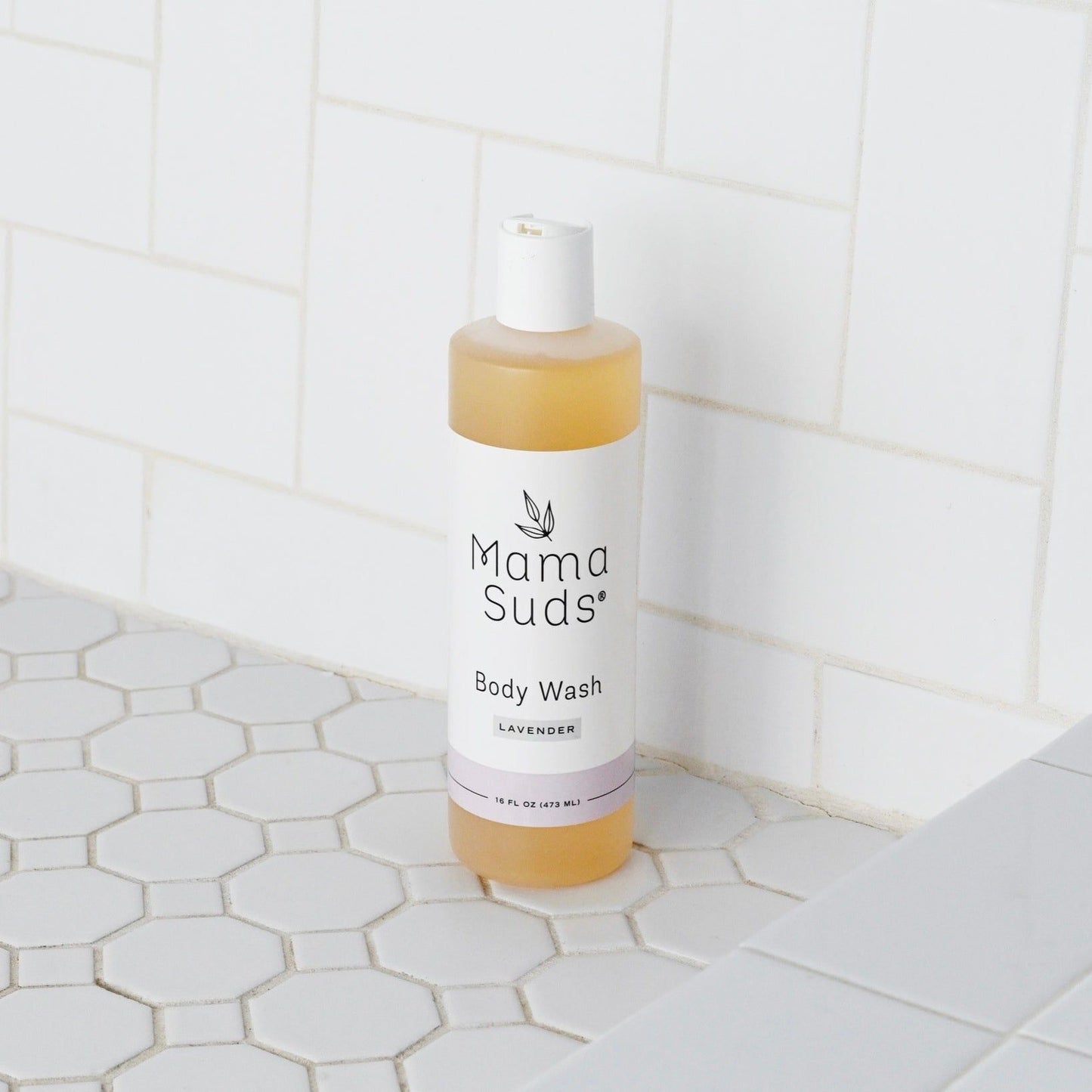 Unscented MamaSuds body wash soap for household cleaning, shown in a clear bottle with a pump dispenser.