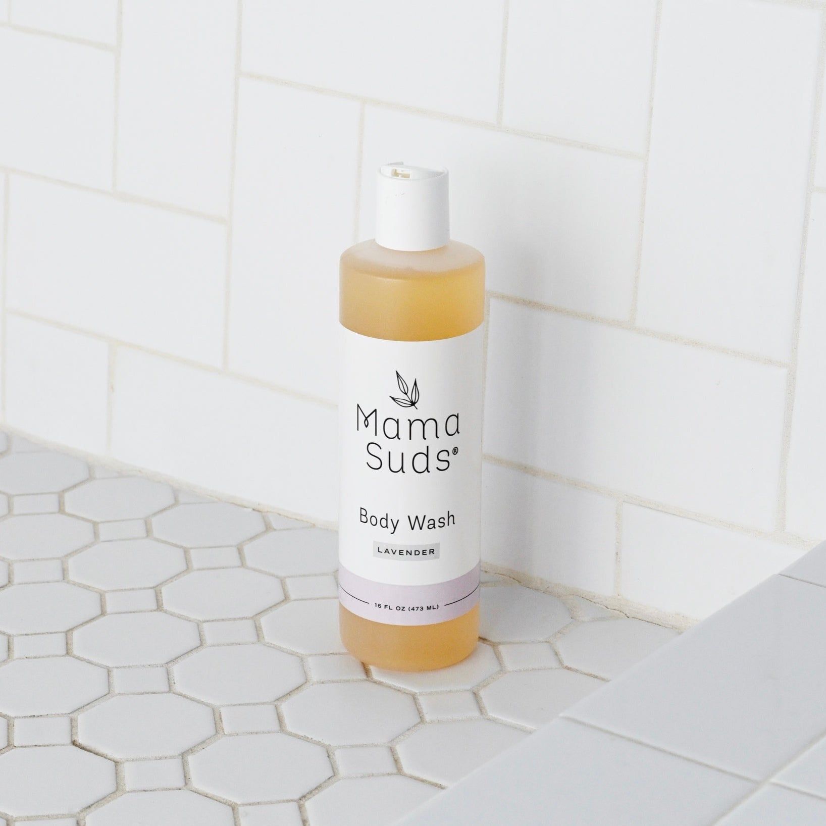 Unscented MamaSuds body wash soap for household cleaning, shown in a clear bottle with a pump dispenser.