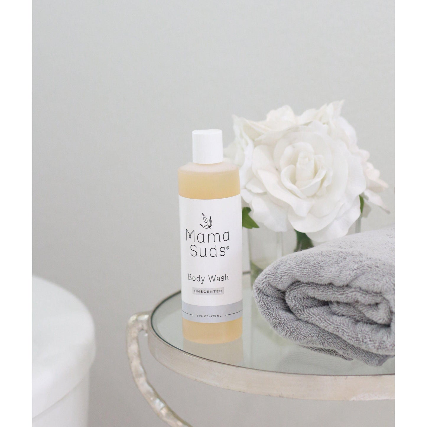 Unscented MamaSuds body wash soap for household cleaning, showing a clear bottle of natural, gentle body wash soap.