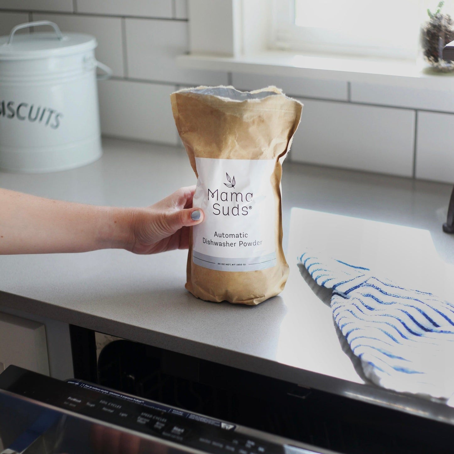 MamaSuds automatic dishwasher powder for eco-friendly, non-toxic household cleaning, shown in a resealable bag.