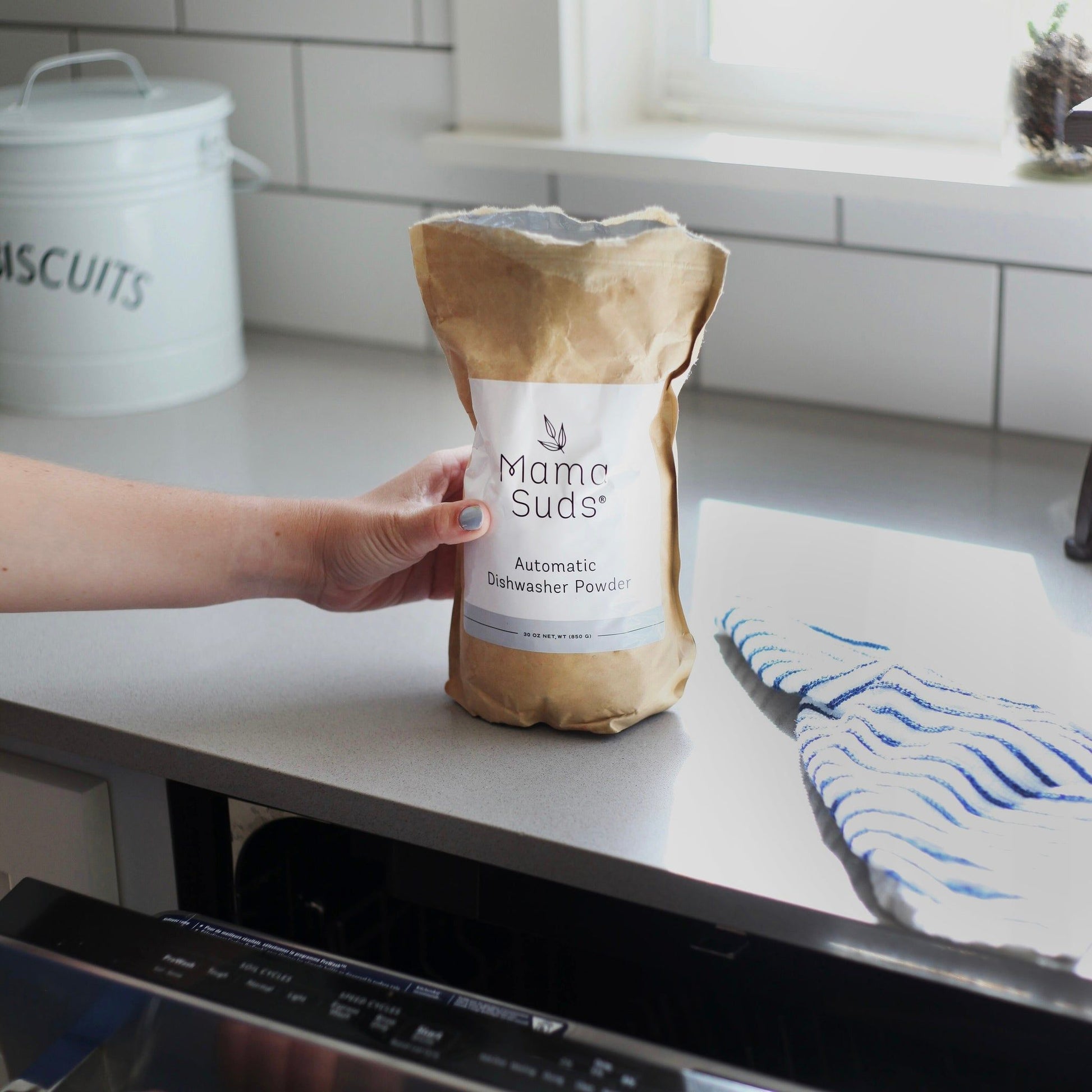 MamaSuds automatic dishwasher powder for eco-friendly, non-toxic household cleaning, shown in a resealable bag.