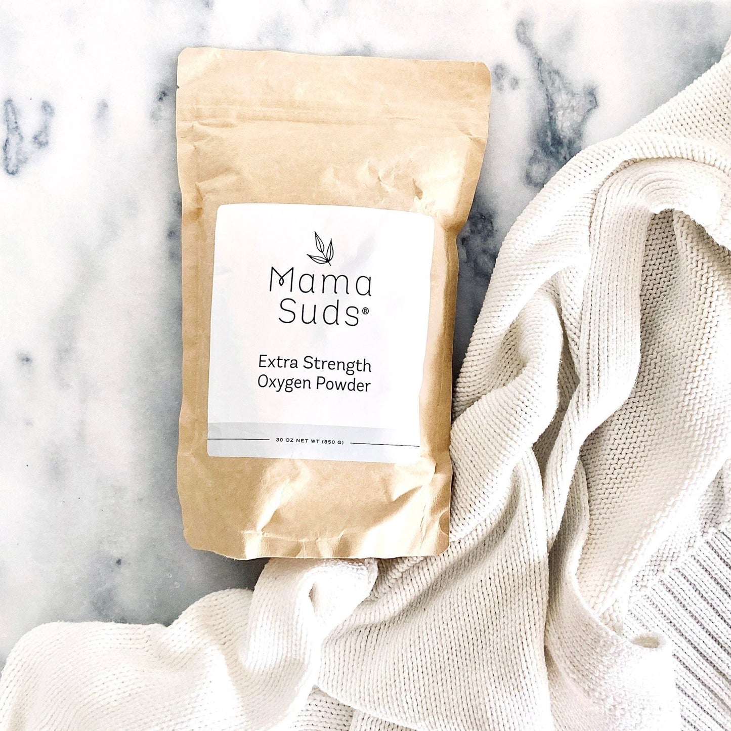 MamaSuds Extra Strength Oxygen Powder for household cleaning, showing the white powder in a clear container.
