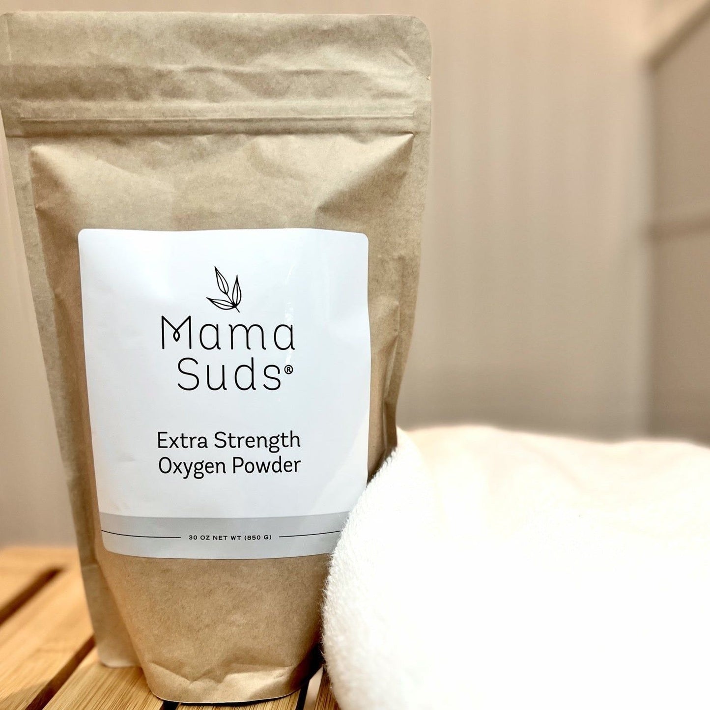 MamaSuds Extra Strength Oxygen Powder for household cleaning, showing the white powder in a clear container.