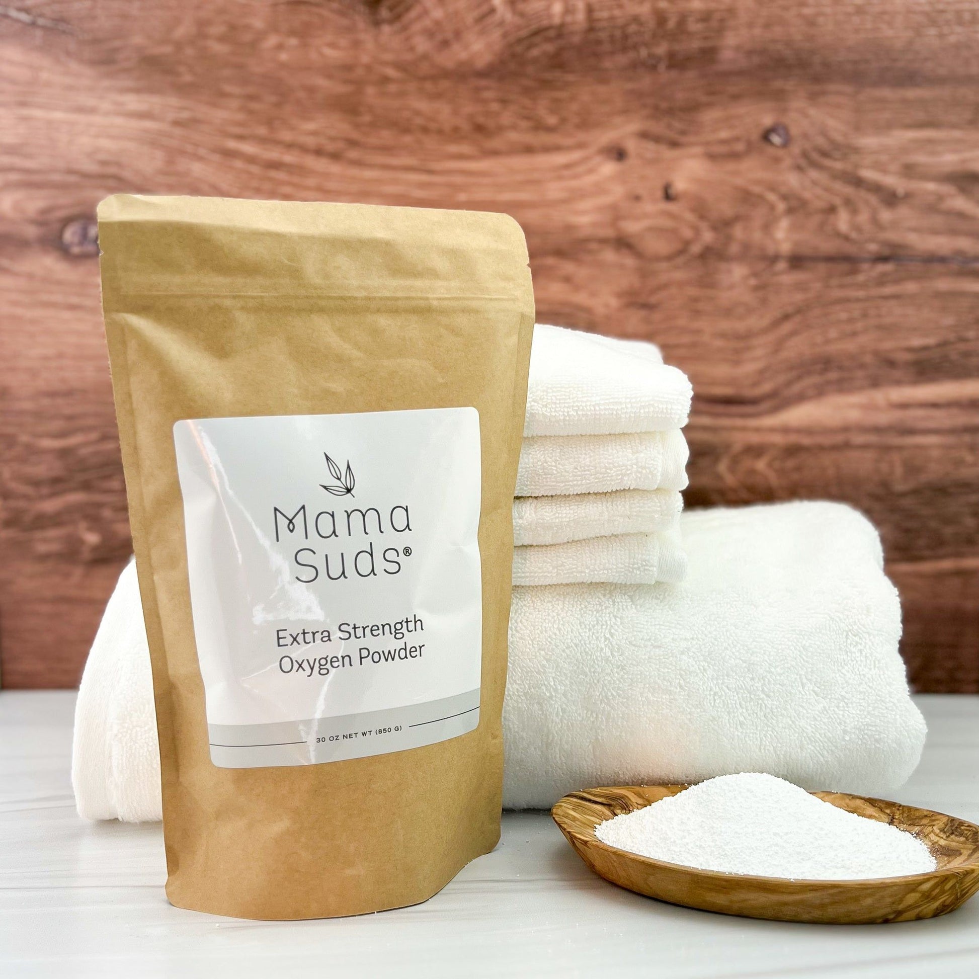MamaSuds Extra Strength Oxygen Powder for household cleaning, showing the white powder in a container.