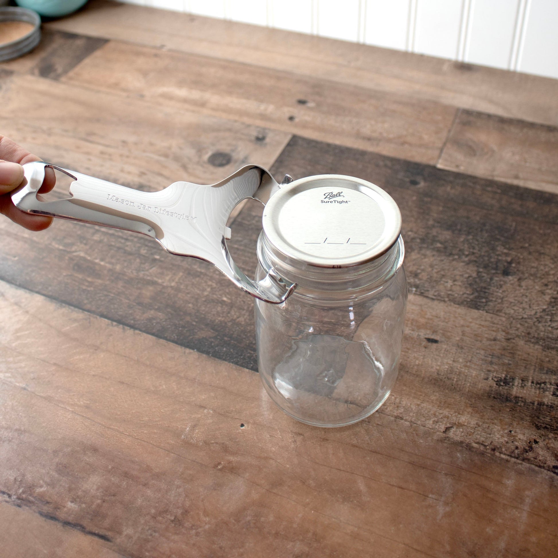 Stainless steel Mason Jar Lifestyle dent-free lid opener with canning lids bundle, designed for easy jar lid removal.