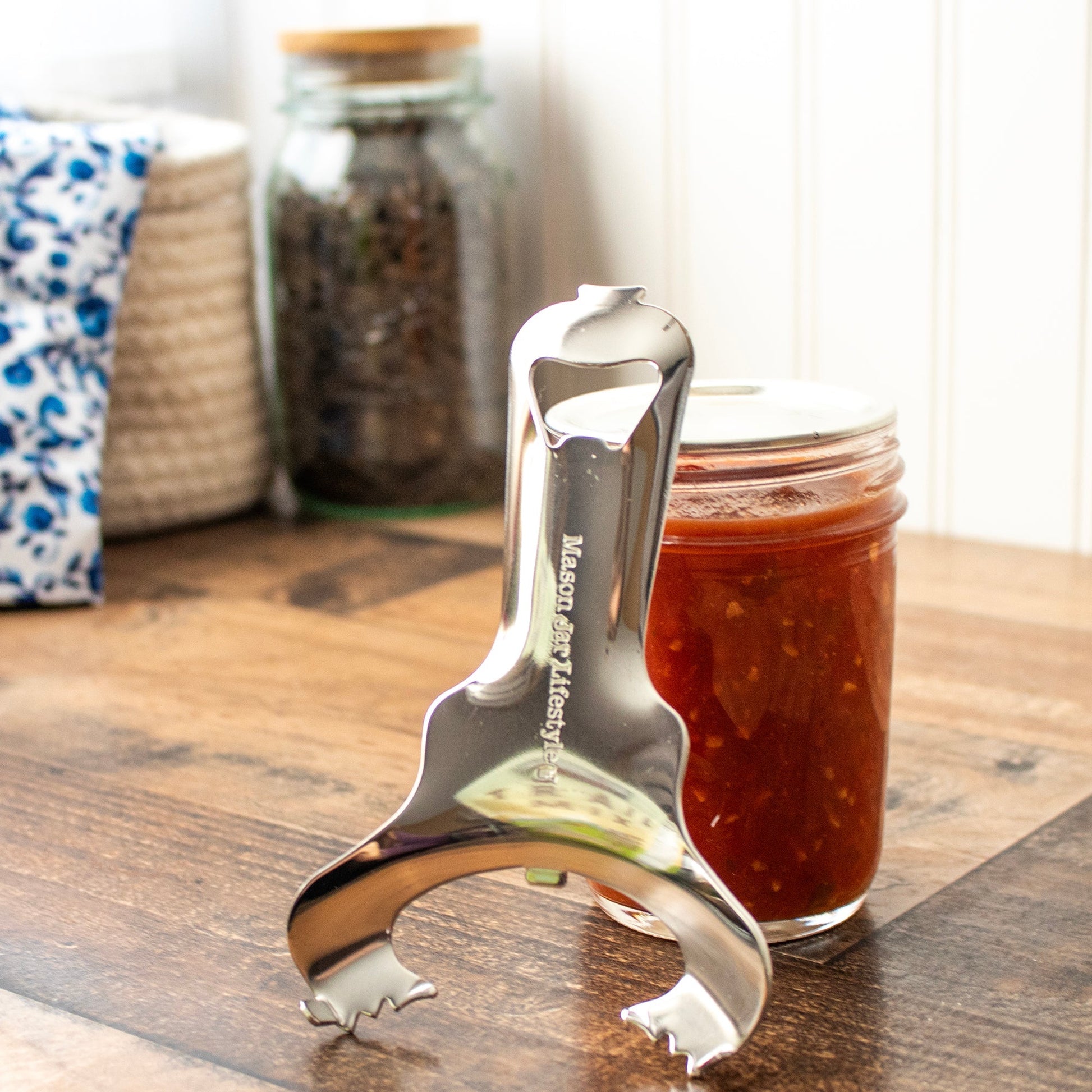 Stainless steel Mason Jar Lifestyle dent-free lid opener with canning lids bundle, designed for easy opening of Mason Jar lids.