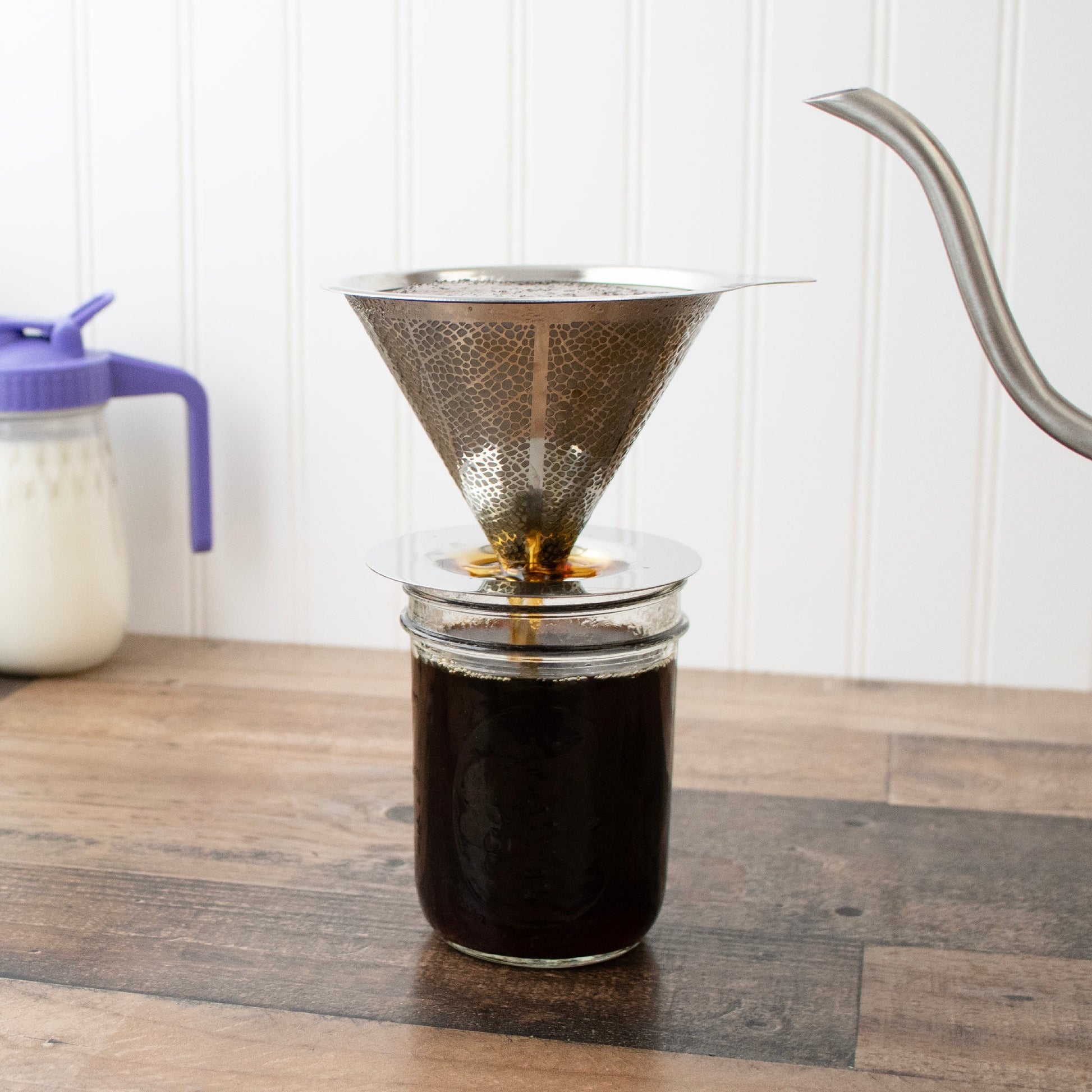 Stainless steel pour-over drip coffee filter for Mason jars, designed by Mason Jar Lifestyle, shown on a glass mason jar.