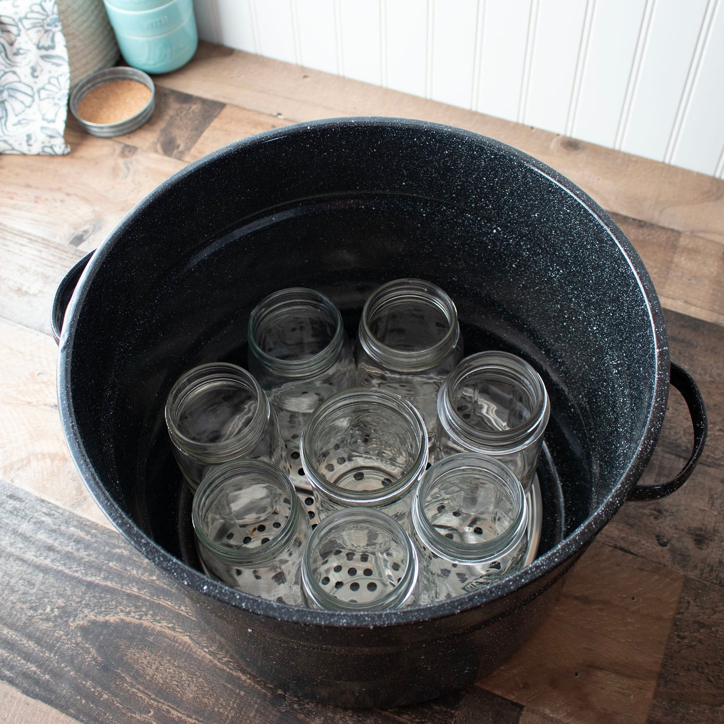 Stainless steel pressure canning rack by Mason Jar Lifestyle with multiple wire tiers for safe jar sterilization.