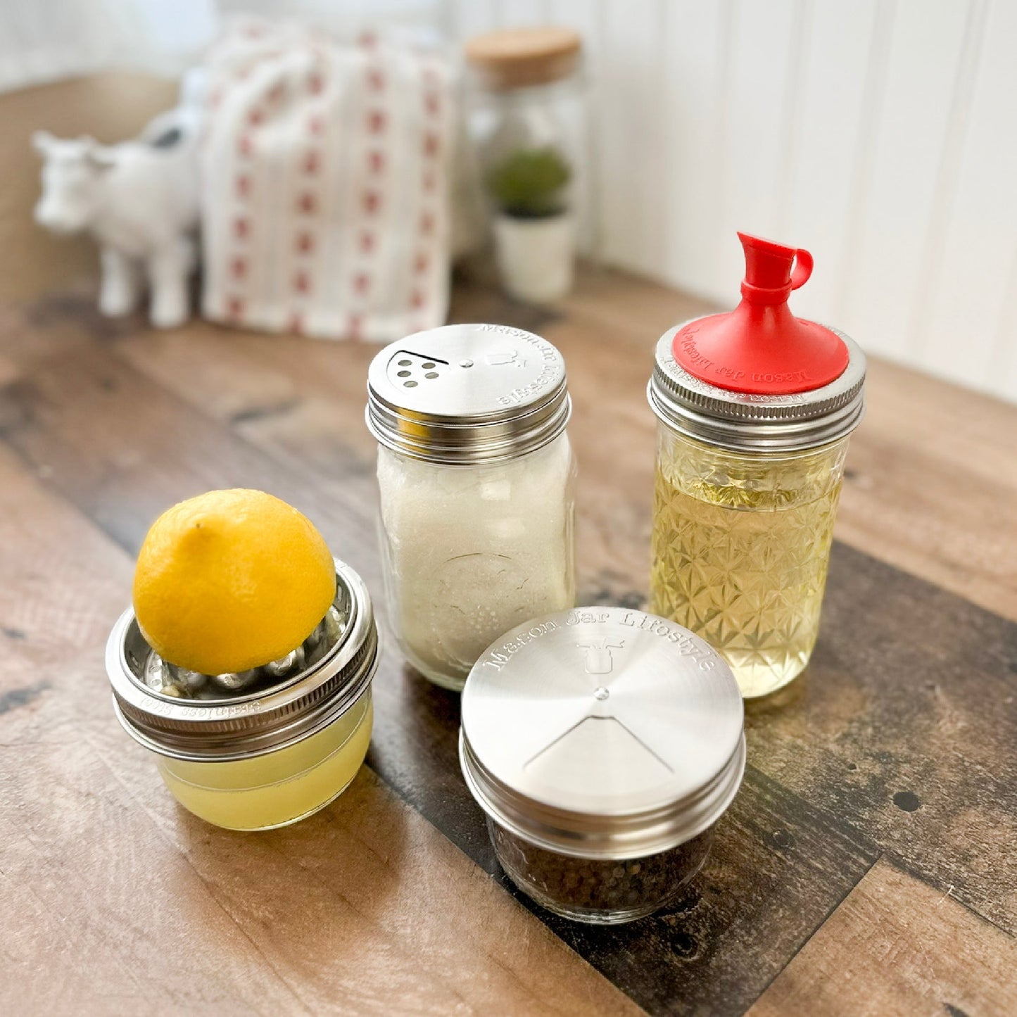 Set of four stainless steel spice shaker lids for mason jars by Mason Jar Lifestyle, designed for home and garden use.