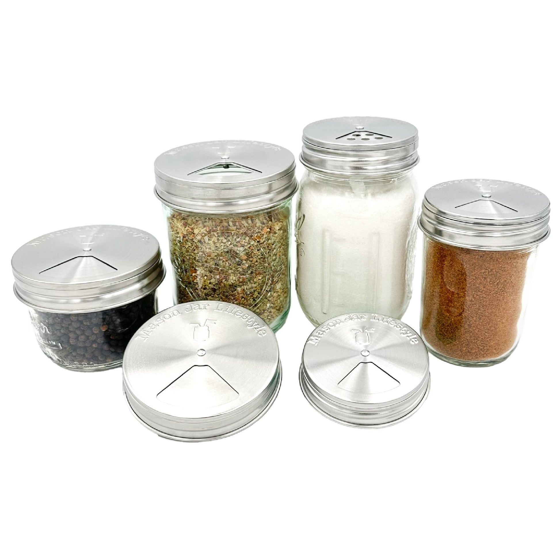 Set of four stainless steel spice shaker lids for mason jars by Mason Jar Lifestyle, ideal for home kitchen storage.