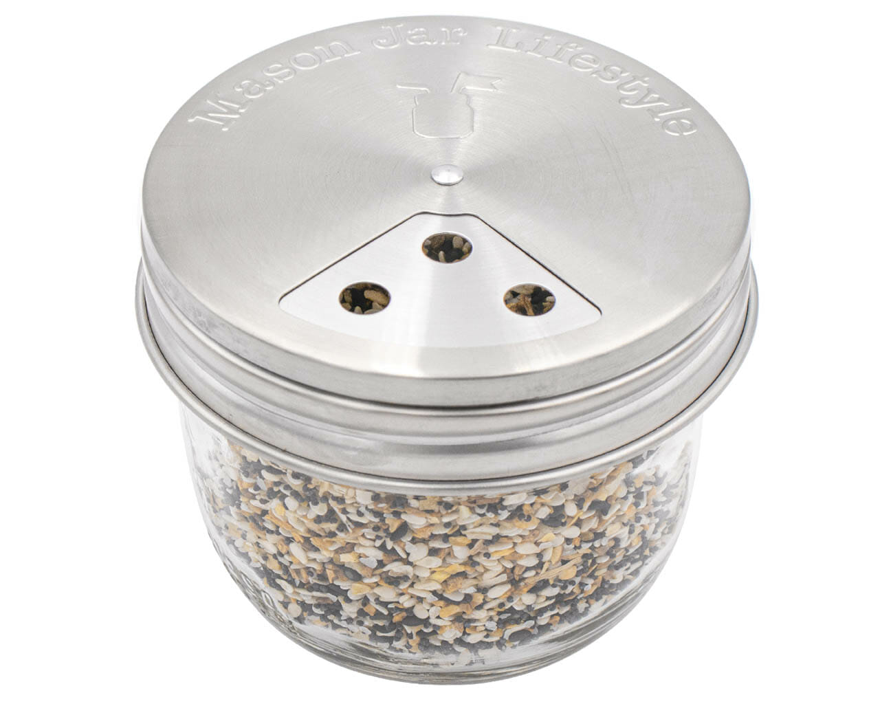 Set of four Mason Jar Lifestyle stainless steel spice shaker lids for regular-mouth mason jars, ideal for kitchen storage and organization.