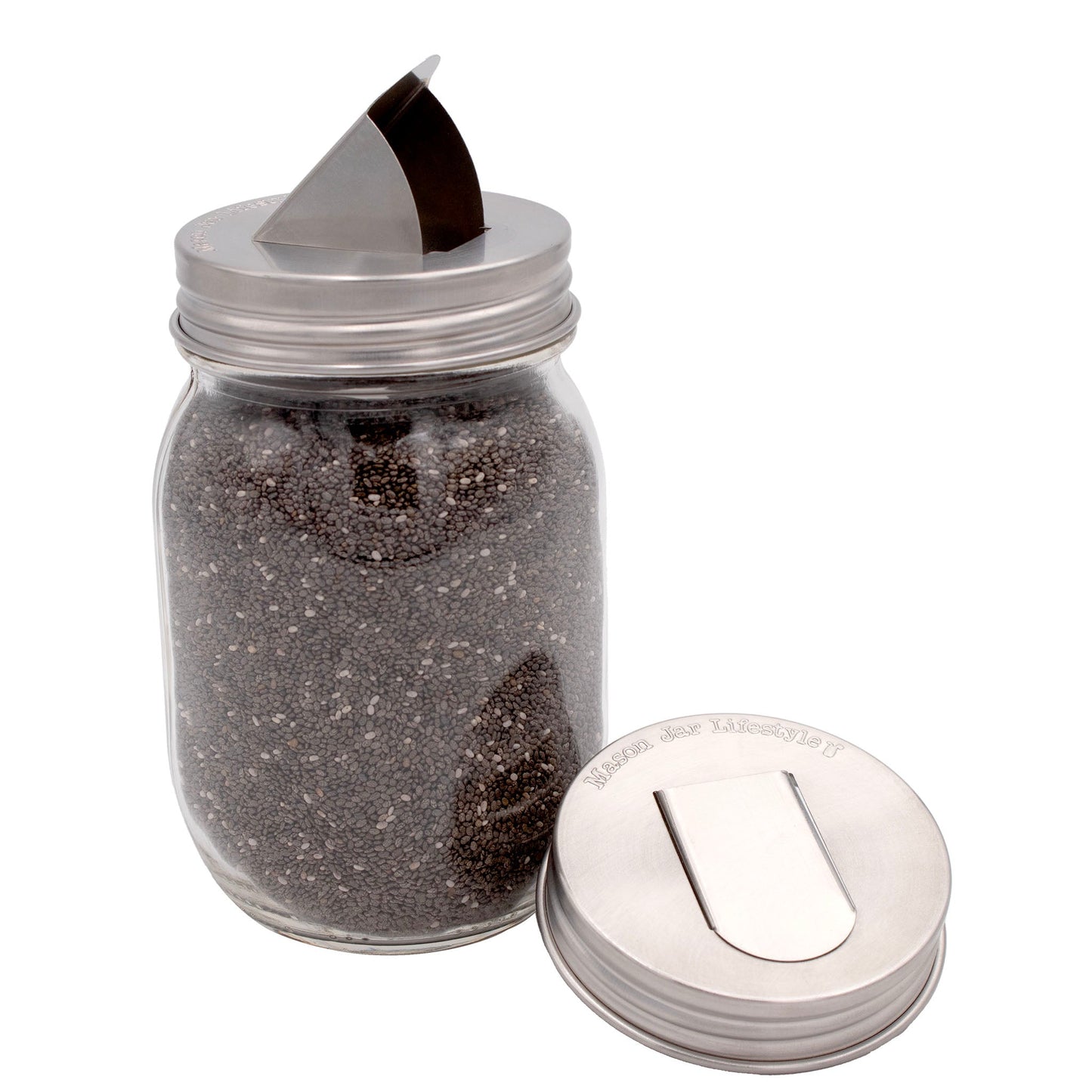 Two stainless steel lids with grain dispensers for regular-mouth Mason jars, designed by Mason Jar Lifestyle.