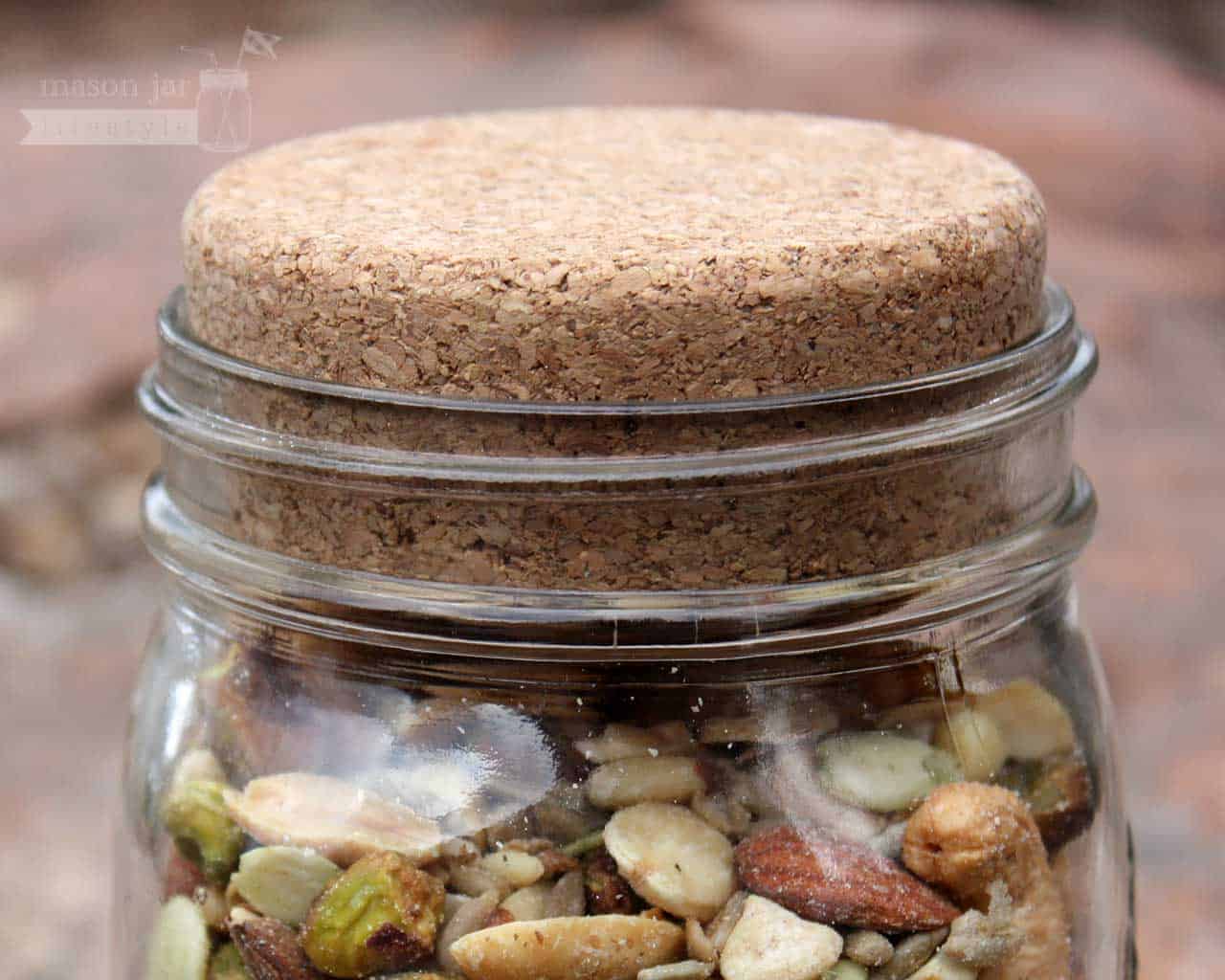 Set of four Mason Jar Lifestyle cork lids for regular-mouth mason jars, perfect for sealing and storing food or beverages.