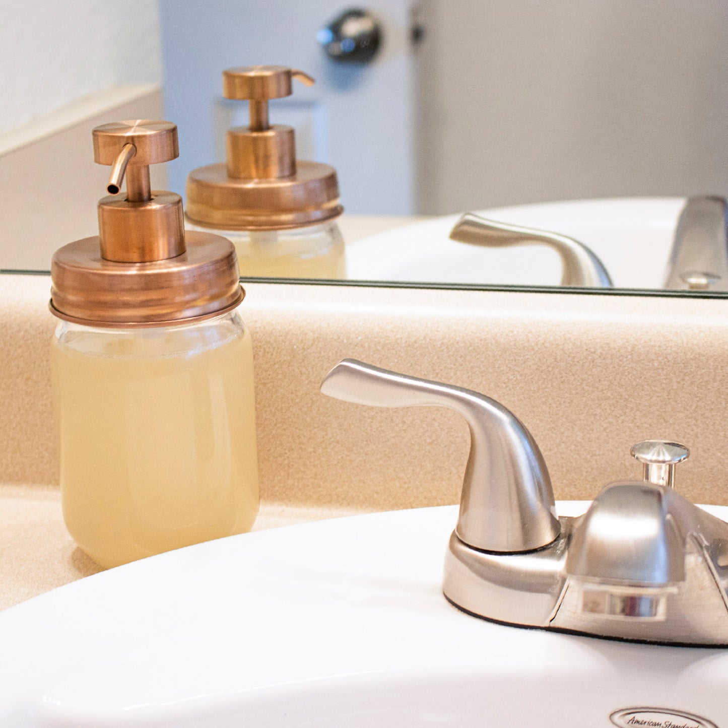 Rose gold soap pump lid kit for regular mouth Mason jars, perfect for bathroom or kitchen soap dispensers, reusable and stylish.