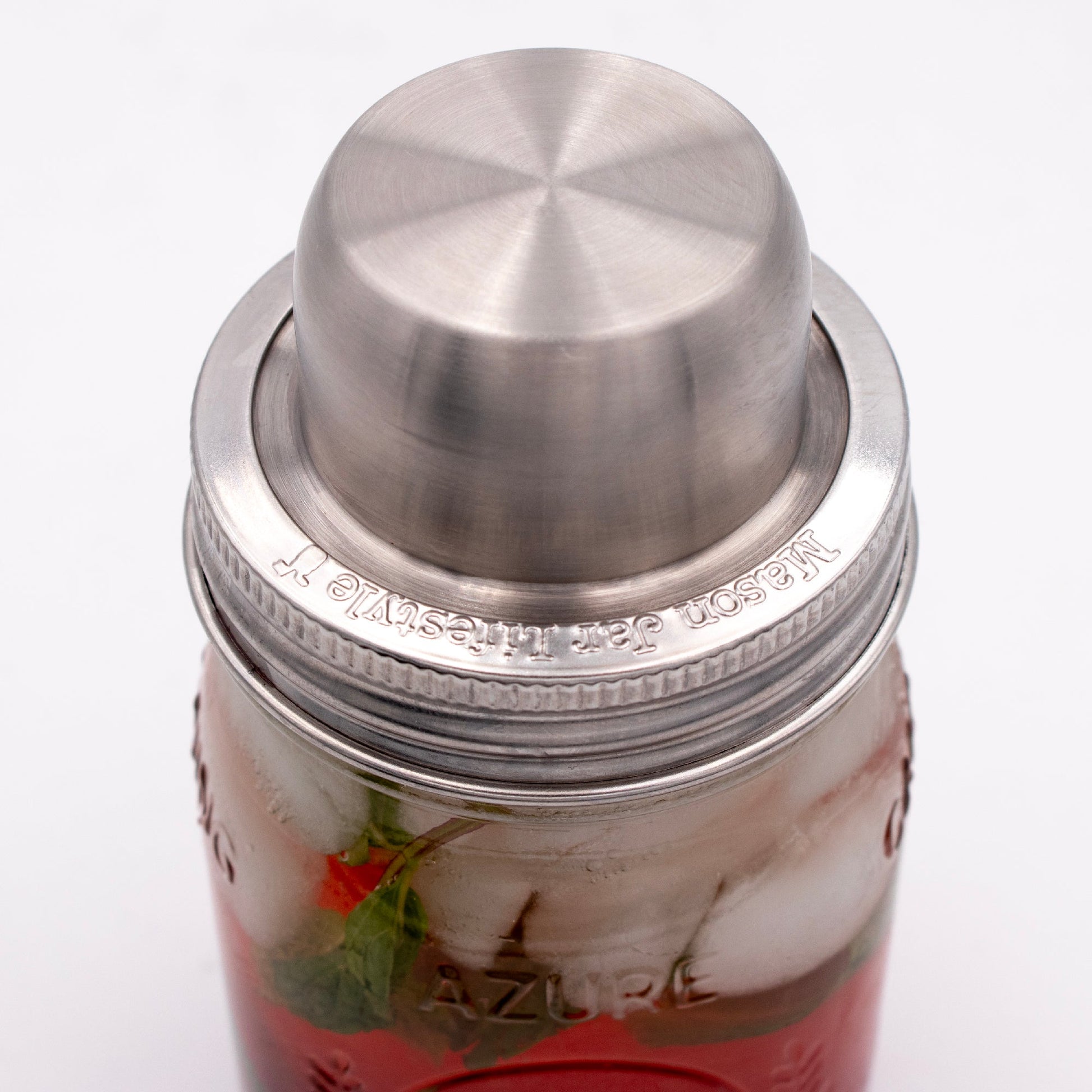 Mason Jar Lifestyle Mason Shaker Cocktail Shaker lid with stainless steel band, ideal for mixing drinks and compact storage.