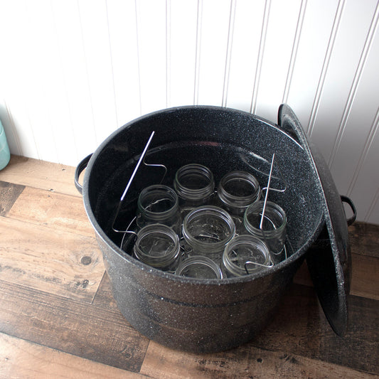Stainless steel water bath canning rack from Mason Jar Lifestyle inside a canning pot, designed for regular-mouth jars.