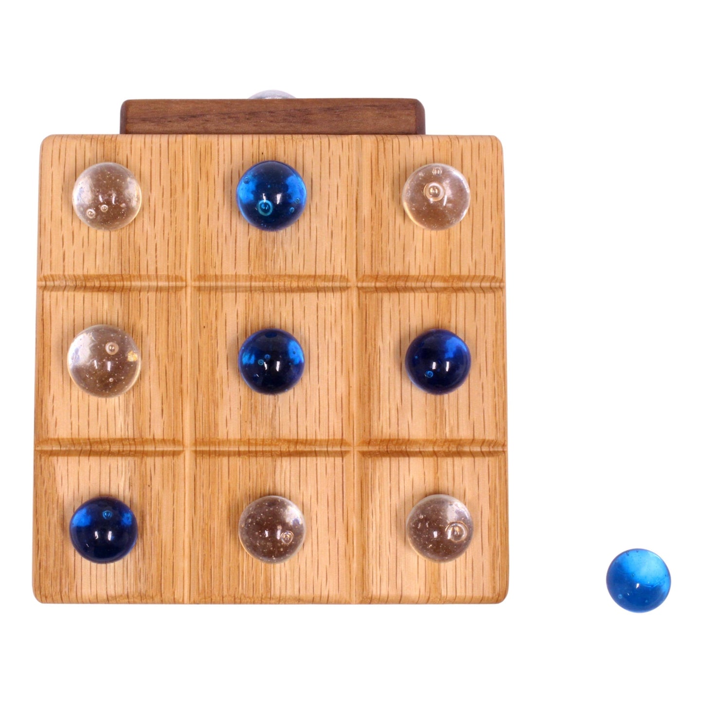 Wooden Tic Tac Toe game with built-in marble storage, AmishToyBox.com wooden toy featuring a classic game and organized marble compartments.