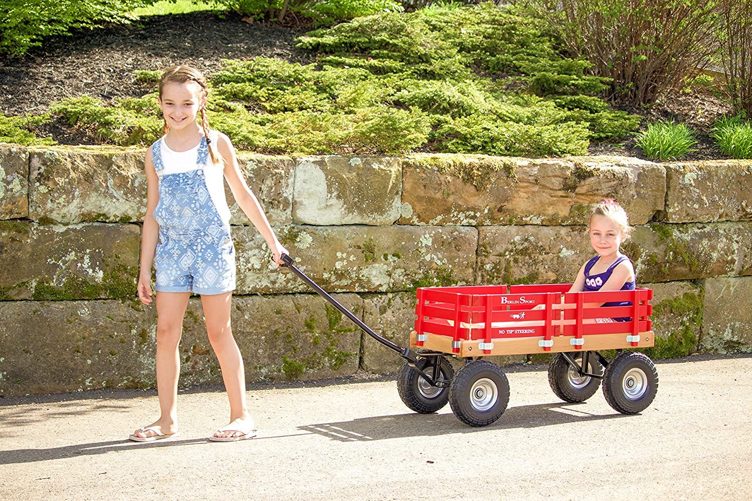 Amish-made Berlin Flyer Sport Wagon Model F410, a durable children's scooter and wagon by AmishToyBox.com, shown in a natural outdoor setting.