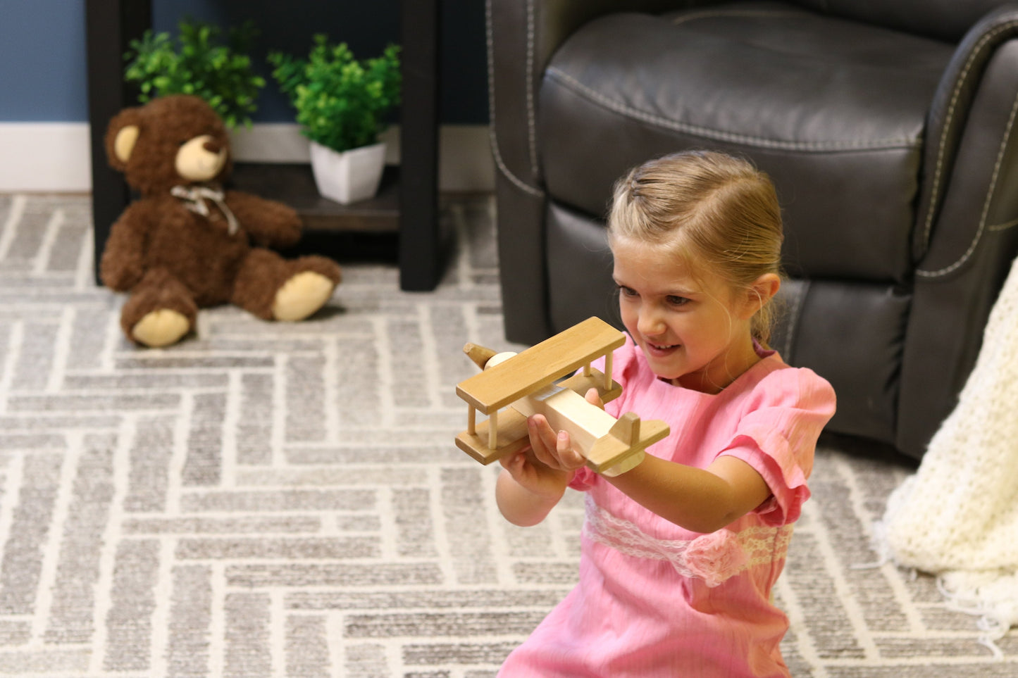 Wooden toy airplane with spinning propeller and kid-safe finish, handcrafted by AmishToyBox.com.