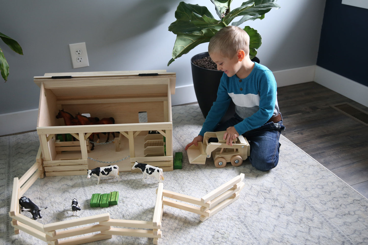 Wooden skid loader toy with movable bucket, AmishToyBox.com wooden toy skid steer for imaginative play.