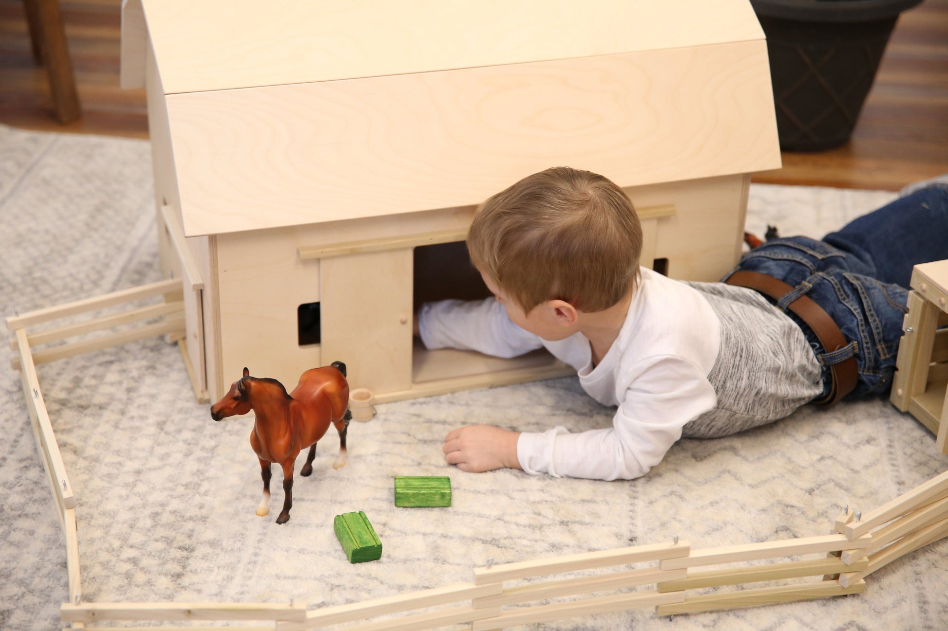 Amish-made large unfinished wooden hip-roof barn toy, ideal for children, showcasing detailed farm building craftsmanship.