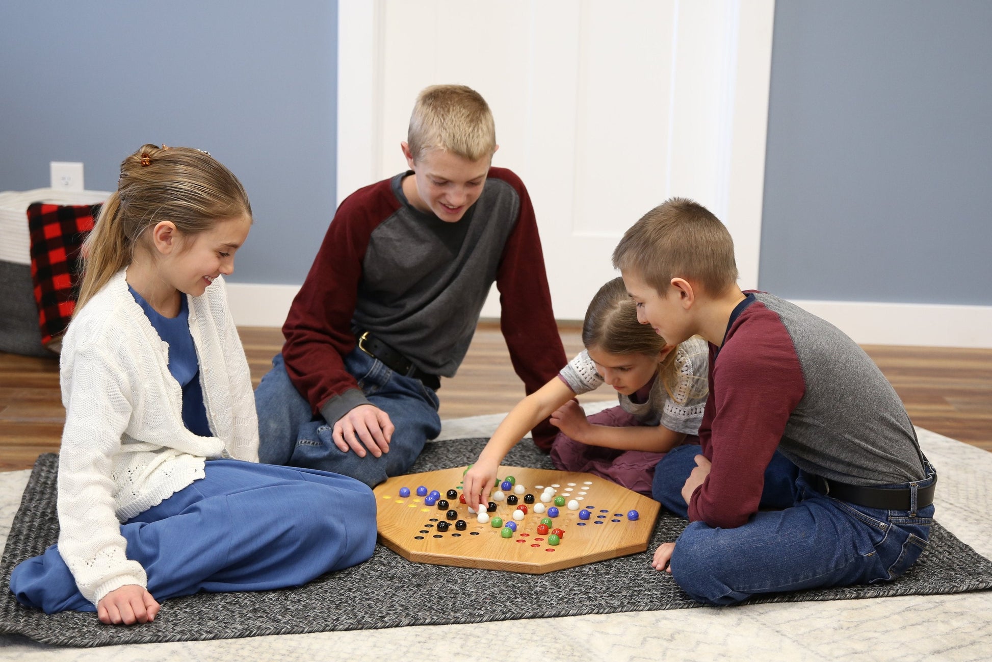 Hand-painted oak wooden Chinese Checkers board game, 19-inch wide, featuring colorful hand-painted game pieces on a smooth wooden surface.