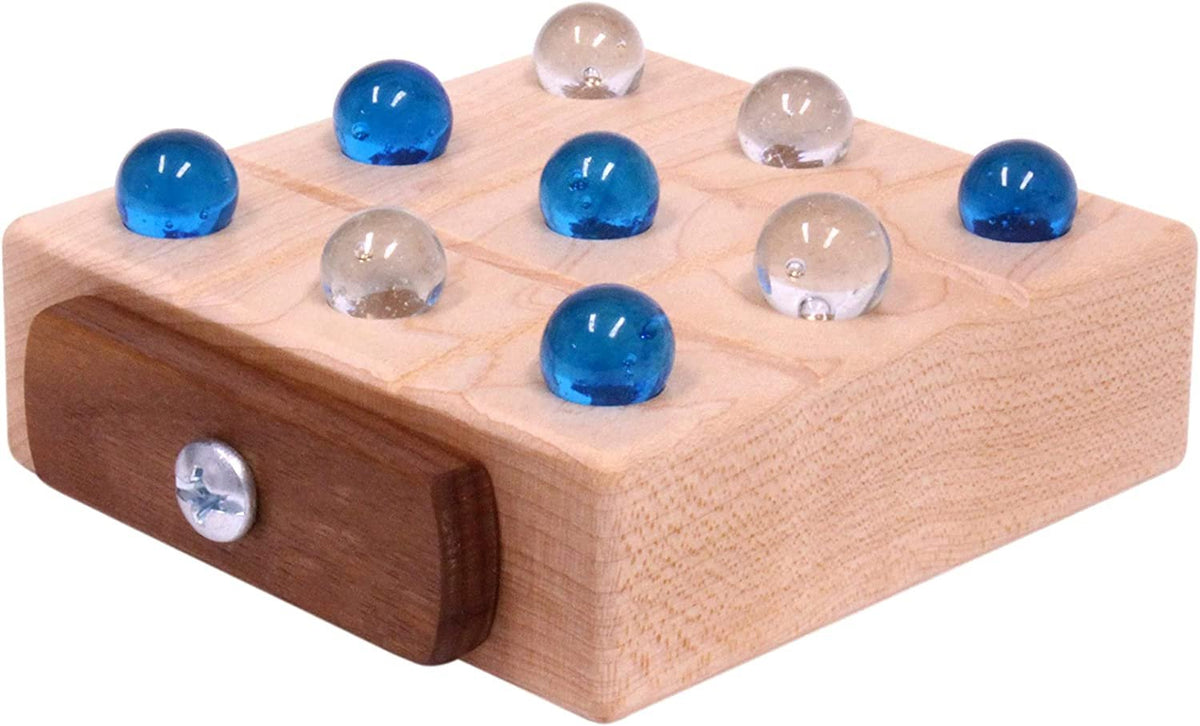 Wooden marble tic tac toe game with built-in storage, handcrafted by AmishToyBox.com, featuring a wooden board and colorful marbles.