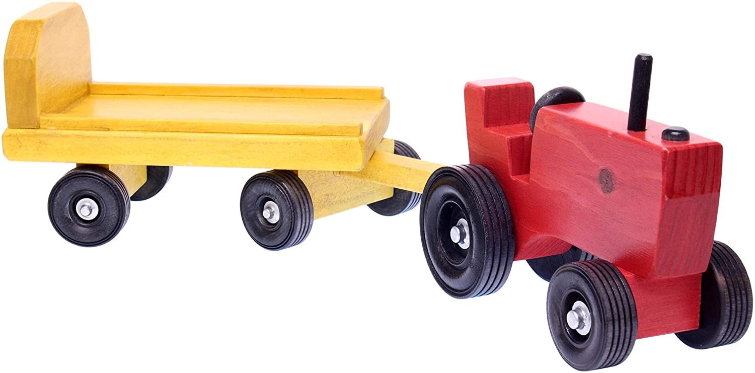 Amish-made wooden toy tractor and wagon set with hay bales, featuring detailed craftsmanship and natural wood finish.