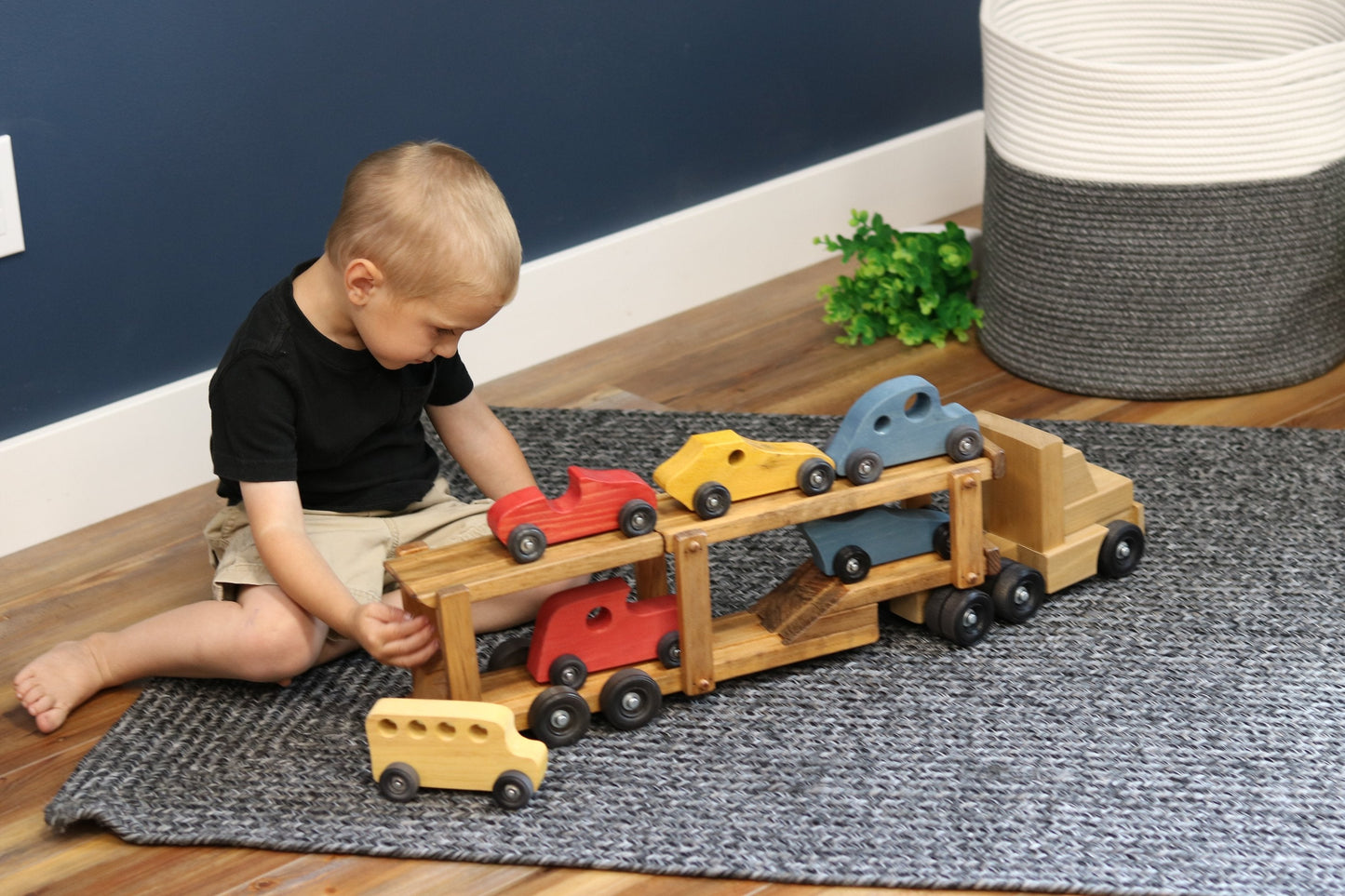 Wooden car carrier semi truck and trailer toy set with six colorful wooden cars, suitable for children, by AmishToyBox.com.