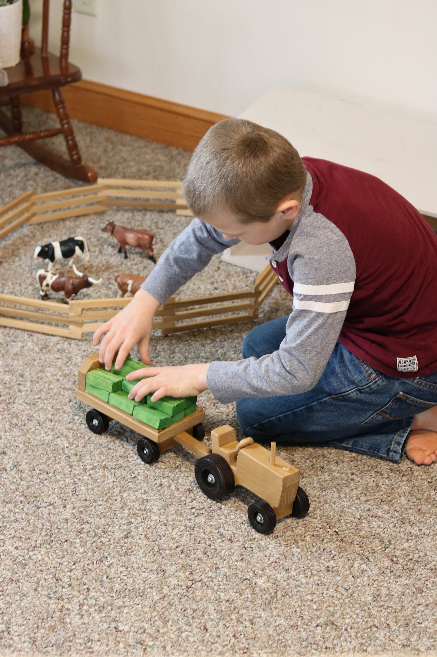 Amish-made wooden toy tractor and wagon set with hay bales, perfect for children's play, by AmishToyBox.com.