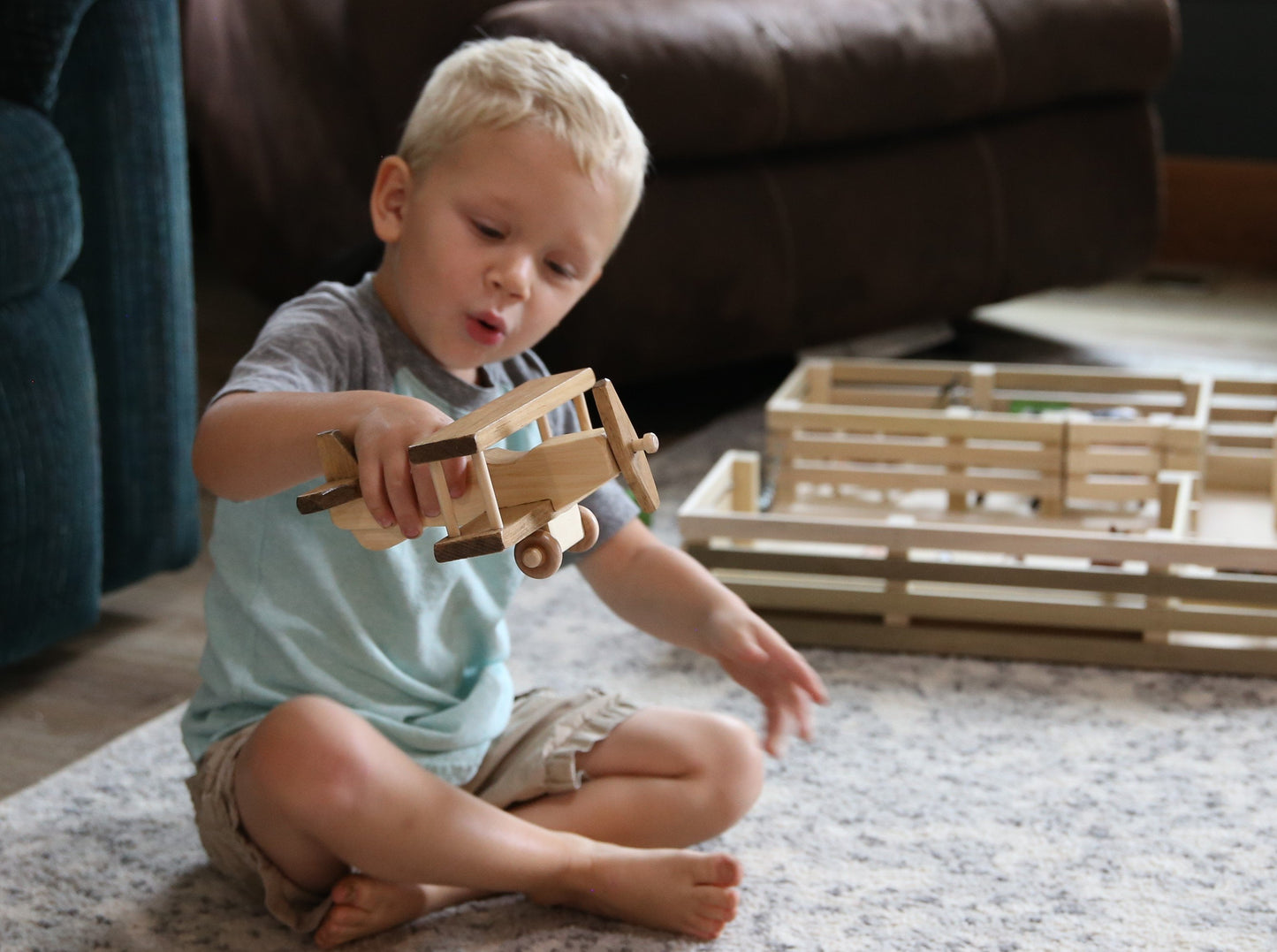 Wooden toy airplane with spinning propeller and kid-safe finish, crafted by AmishToyBox.com for children’s imaginative play.