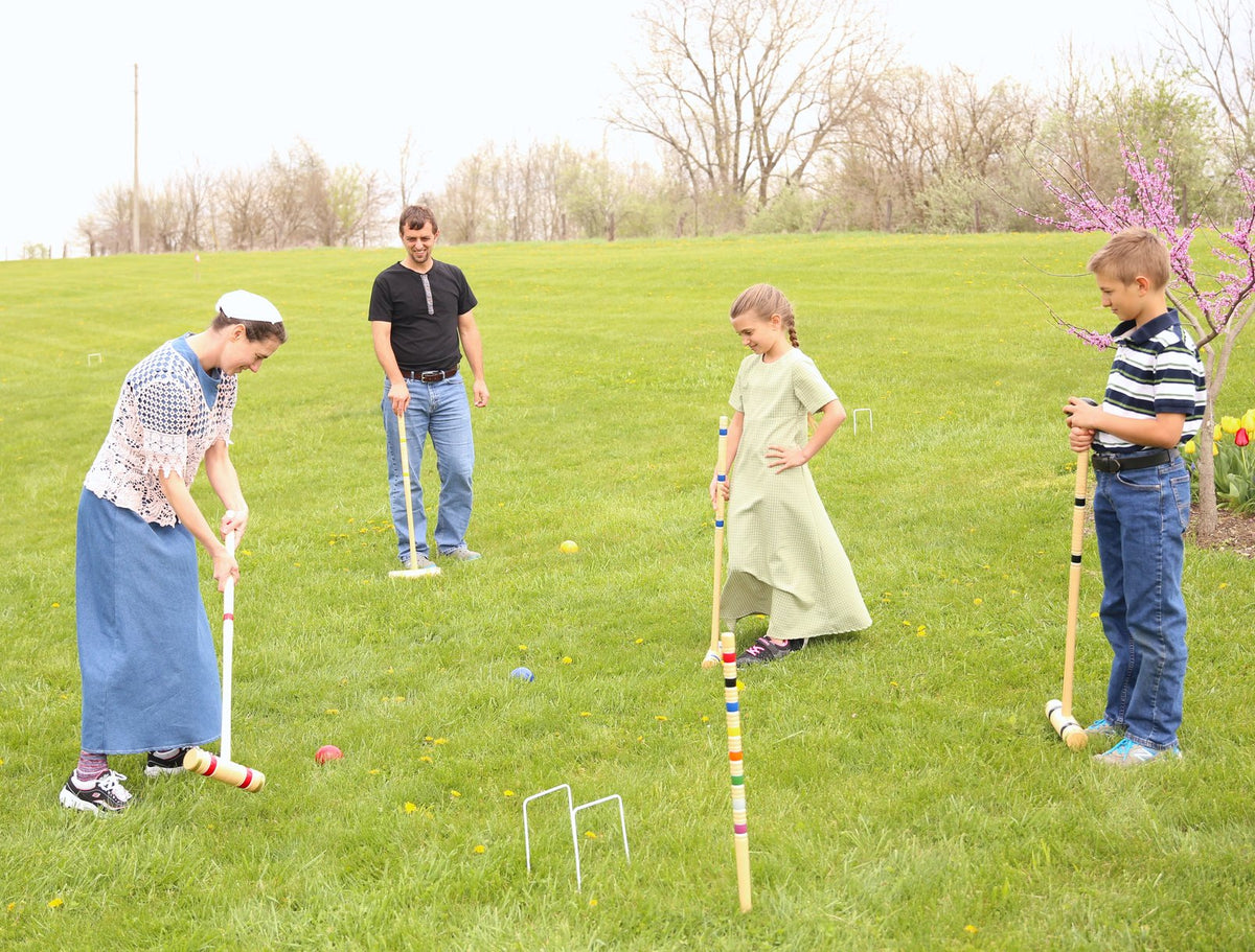 Amish-made Deluxe Croquet Game Set for 6 players with wooden mallets and balls, stored in a wooden holder, perfect for outdoor play.