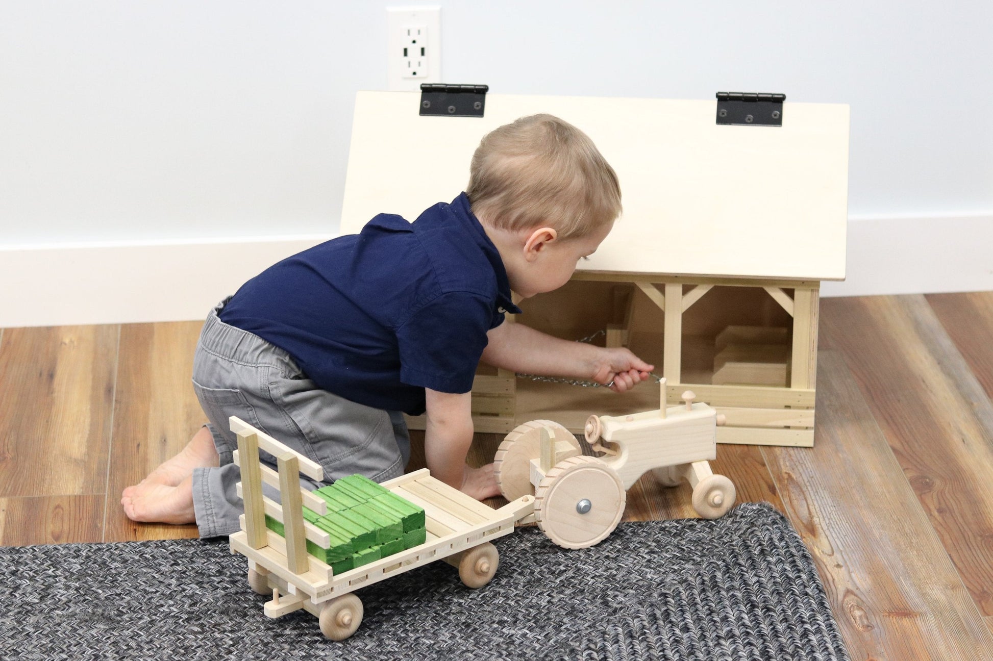 Amish-made wooden toy tractor and hay wagon set with hay bales, perfect for children’s imaginative play and farm-themed fun.