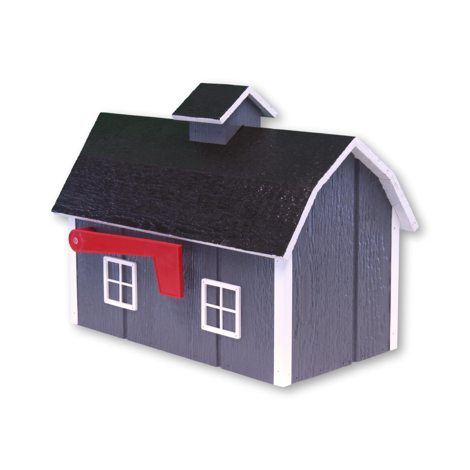 Amish-made Dutch barn style wooden mailbox mounted on a post in a garden setting, crafted from durable wood for curbside delivery.