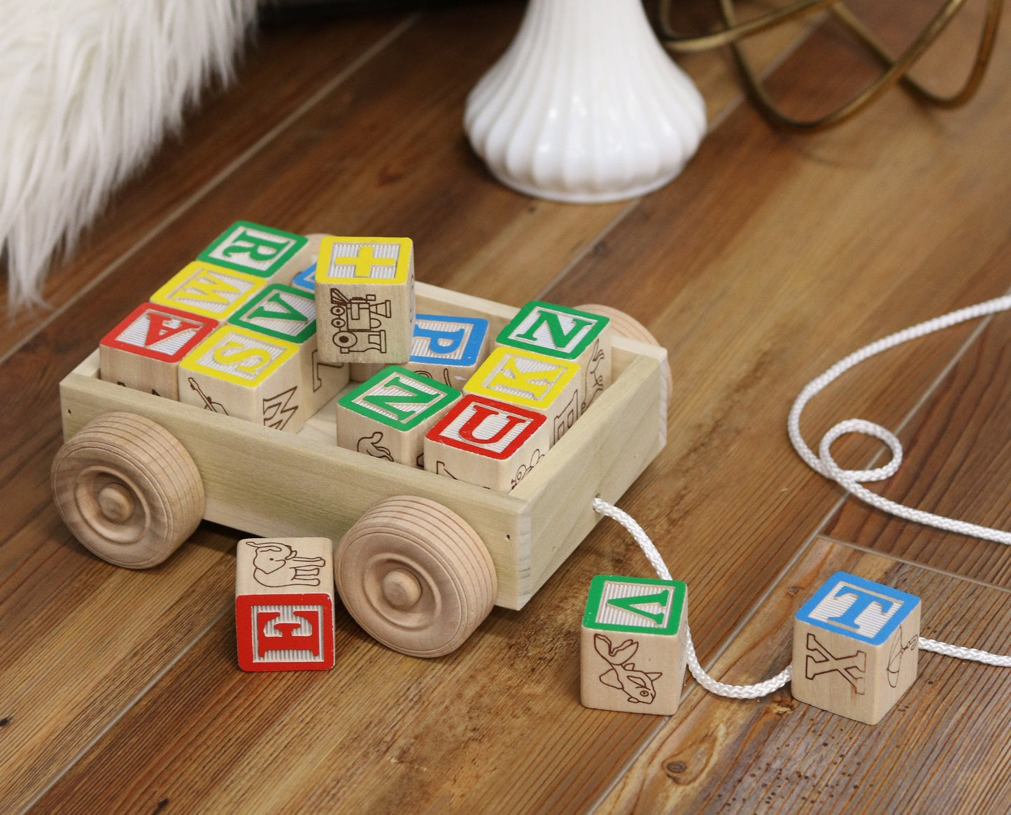 Amish-made wooden ABC block toddler pull-string wagon toy with colorful alphabet blocks inside, ideal for early learning and play.