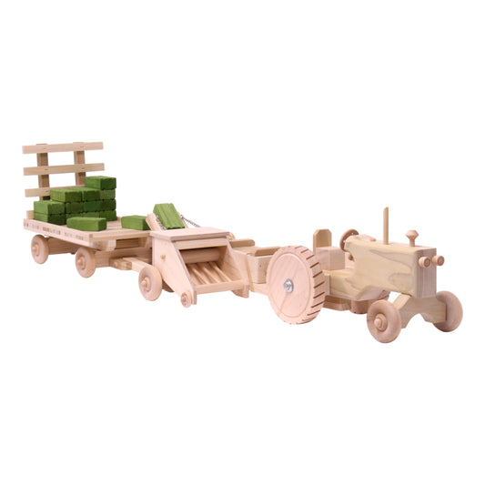 Wooden toy tractor, hay baler, hay wagon, and 16 hay bales from AmishToyBox Little Farmer Hay Baling Toy Set.