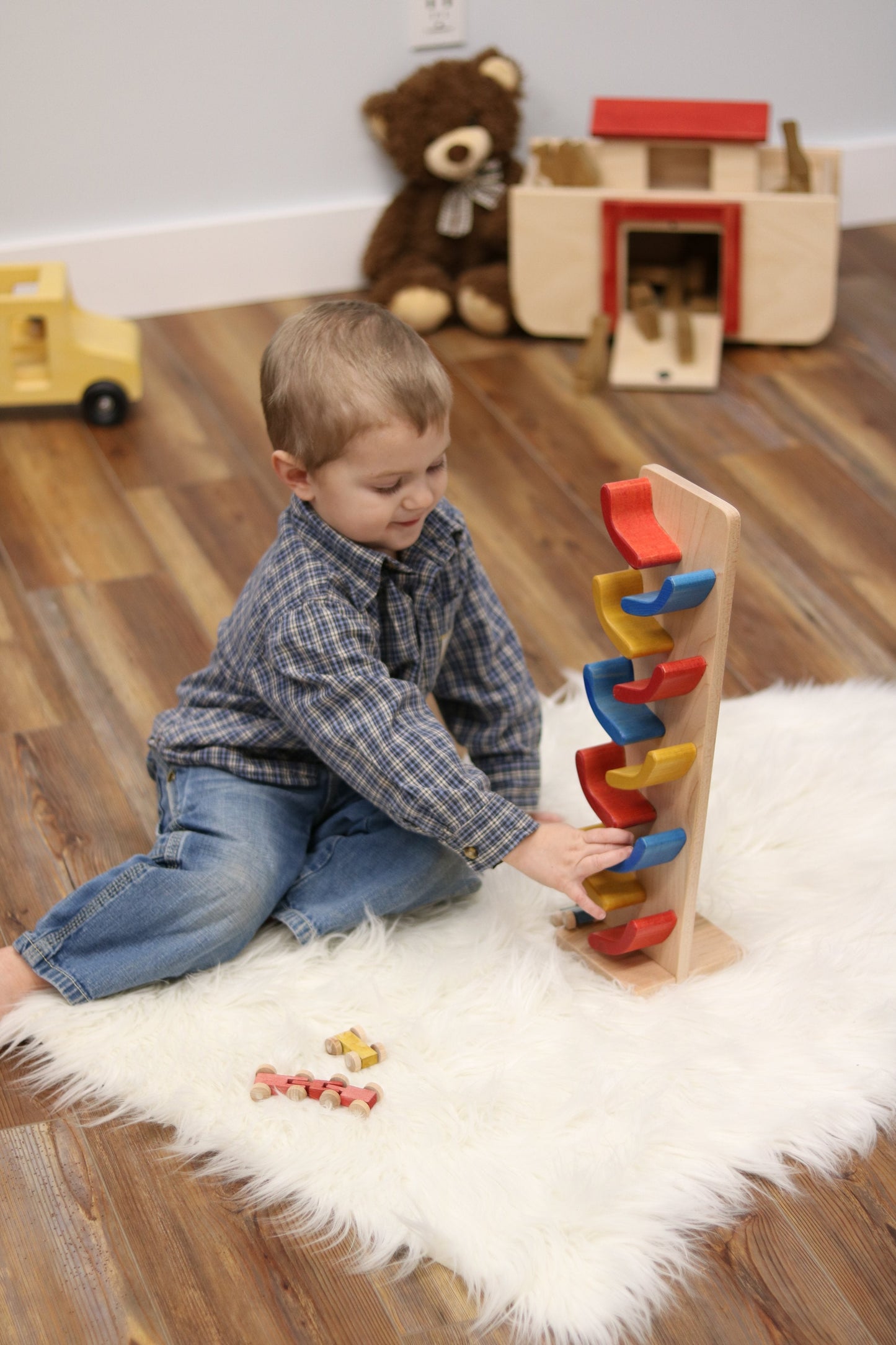 Amish-made mini wooden car roller toy with colorful toy cars included, perfect for children’s imaginative play.