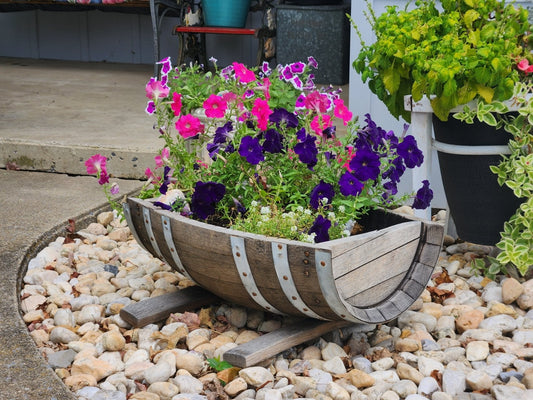 Rustic flower planter made from white oak whiskey barrels by AmishToyBox.com, suitable for indoor or outdoor use.