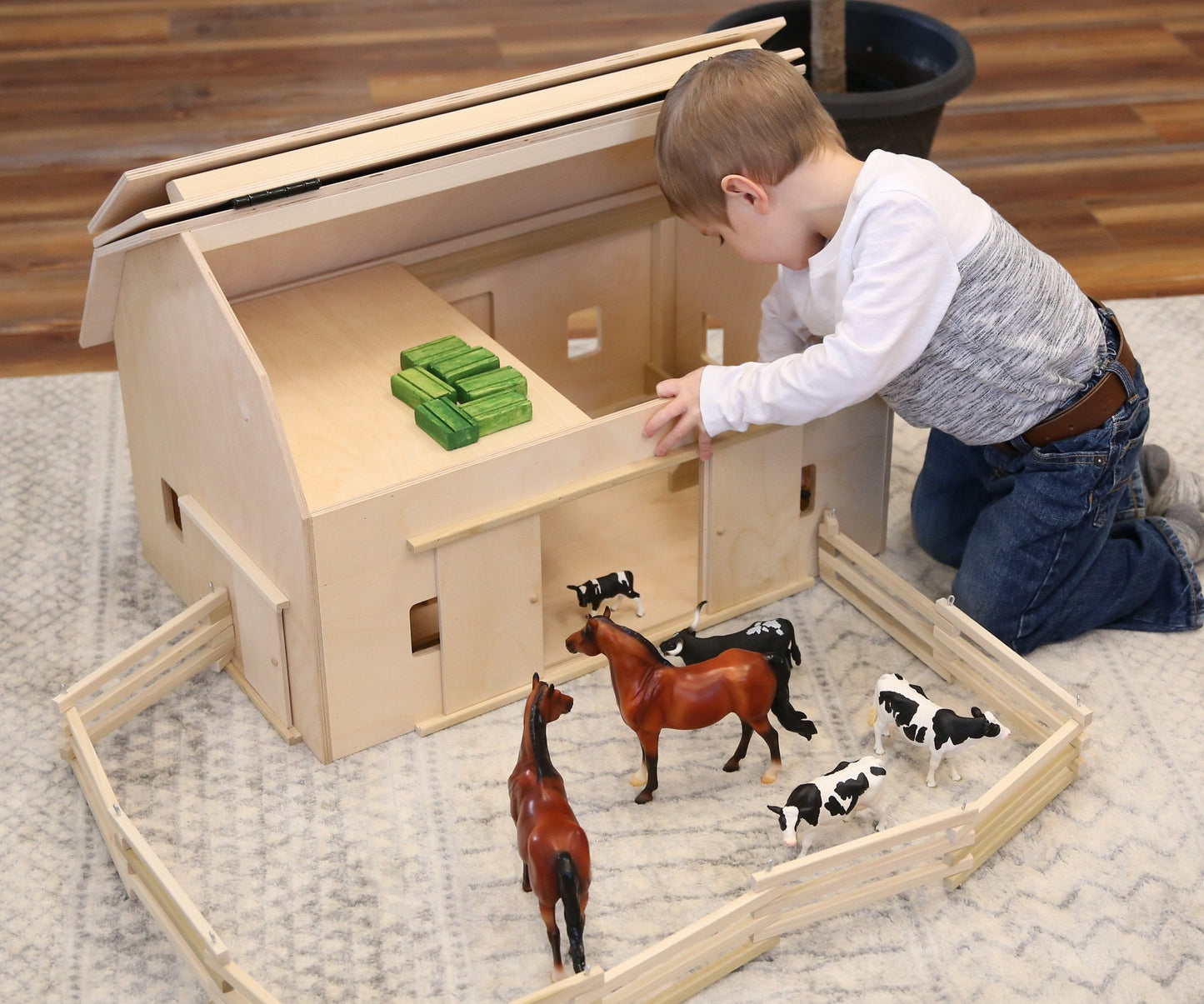 Unfinished large wooden Amish-made hip-roof barn toy for children, crafted from natural wood, part of farming wooden toys collection.