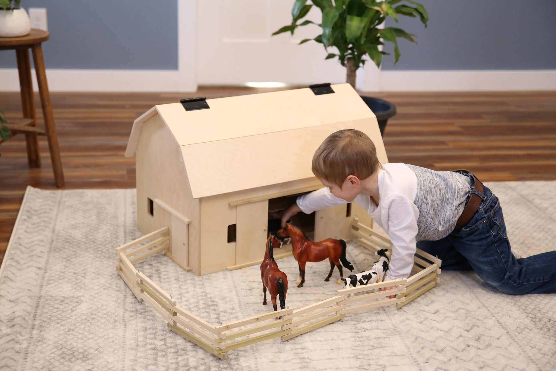 Amish-made wooden folding corral fence toy with unfinished natural wood, suitable for children’s imaginative play.