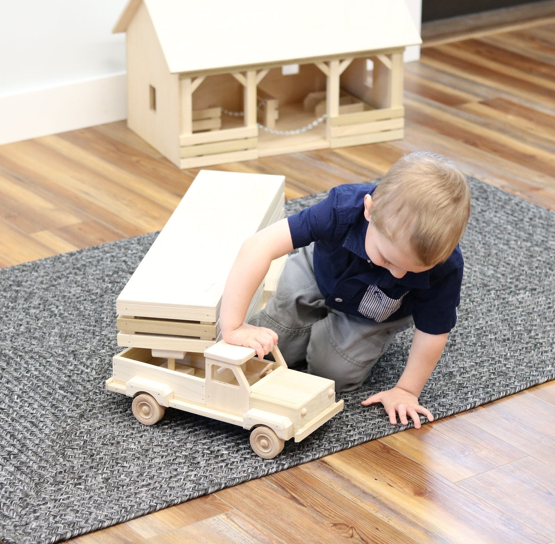 Amish-made wooden toy pickup truck and gooseneck trailer set from AmishToyBox.com, featuring detailed craftsmanship and natural wood finish.