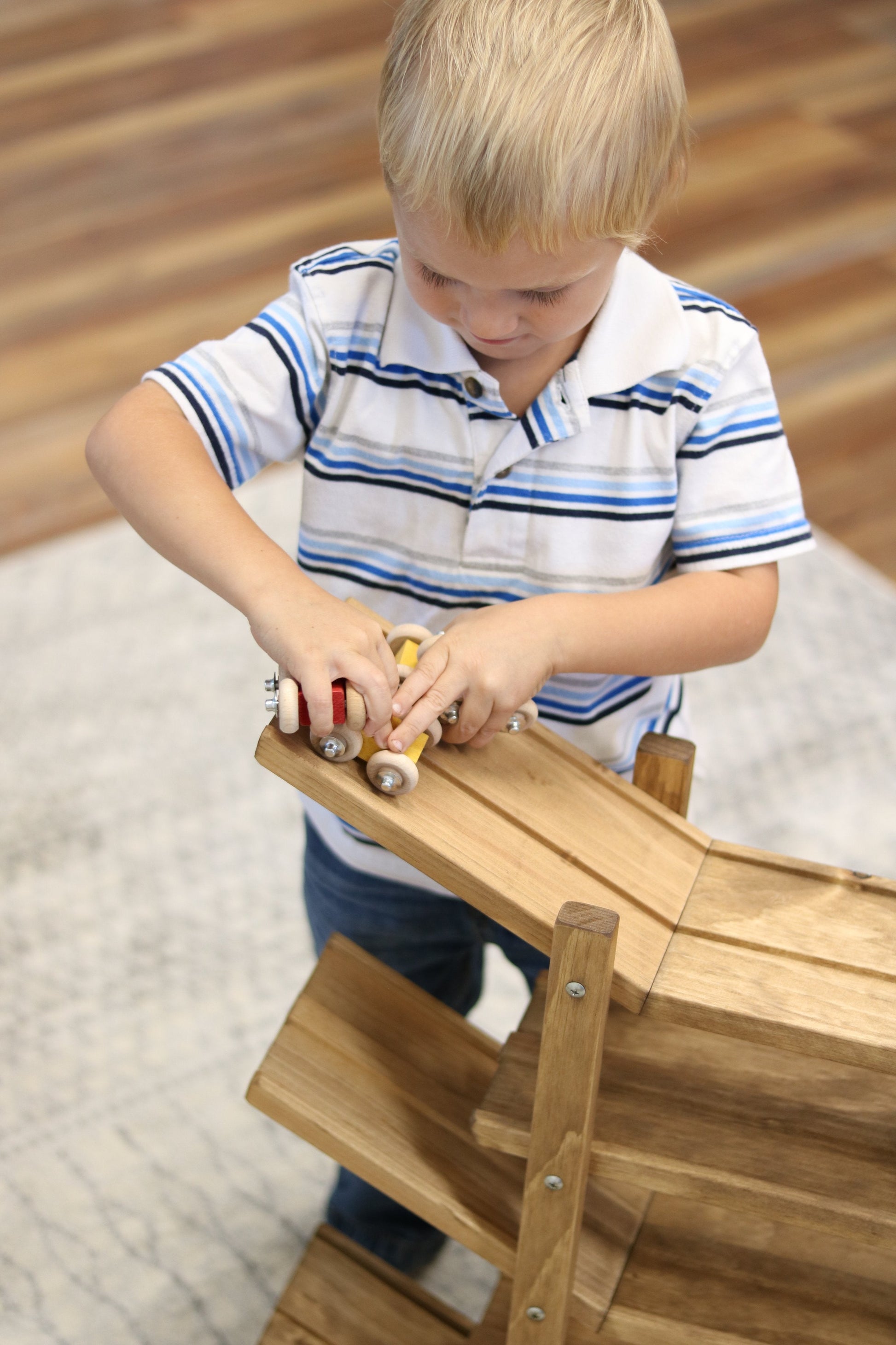 Amish-made handcrafted wooden car roller racetrack toy with colorful marble and ball rollers for children.
