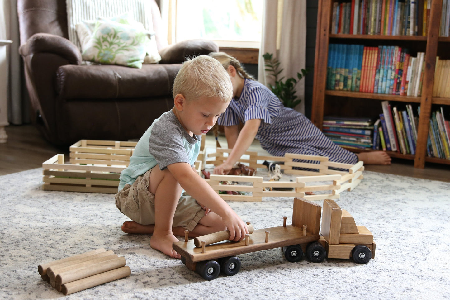 Amish-made wooden log semi truck toy with removable logs, crafted for children, part of wooden train and truck collection.