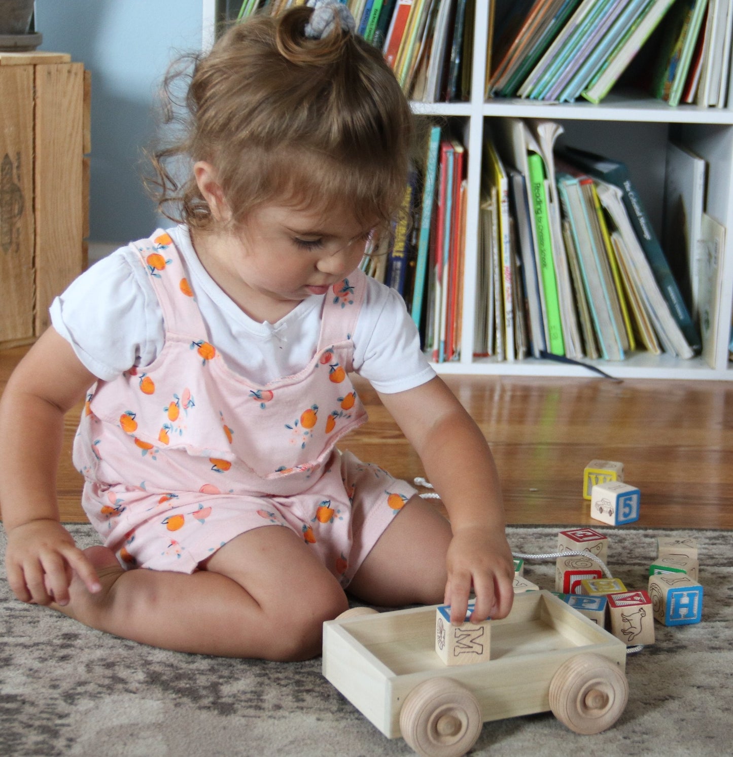 Amish-made wooden ABC block toddler pull-string wagon toy with colorful alphabet blocks and a sturdy wooden wagon handle.