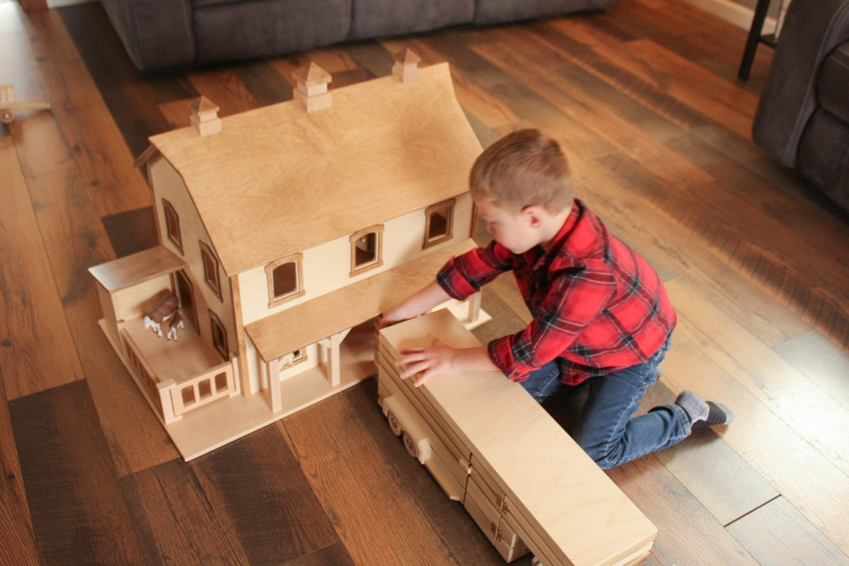 Hand-crafted Pennsylvania Bank Barn toy by AmishToyBox.com featuring detailed wooden barn with silo and farm details, made in Lancaster County.