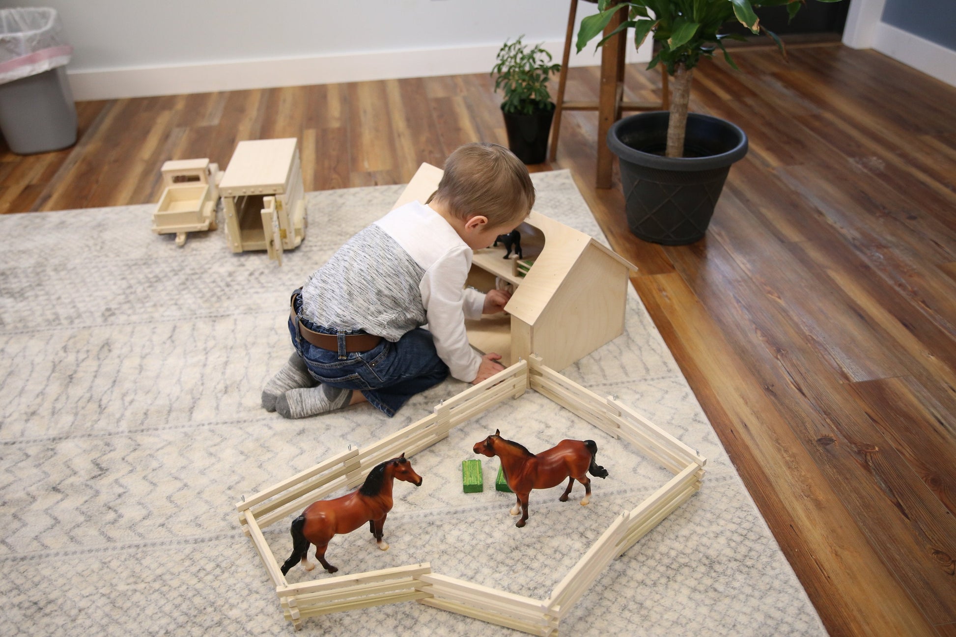 Unfinished wooden Amish-made ranch shed barn toy from AmishToyBox.com, suitable for farming play and educational activities.