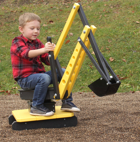 Child playing with AmishToyBox.com sand digger excavator toy featuring movable levers and a metal digging bucket.