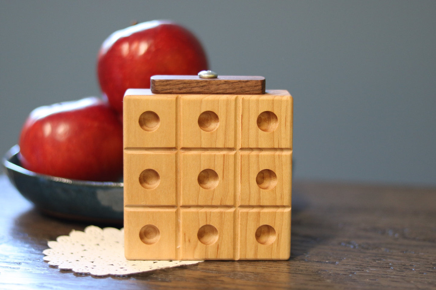 Wooden marble tic tac toe game with built-in storage, featuring natural wood finish and colorful marbles for kids' wooden toy play.